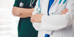 doctor and nurse with arms folded